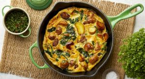 Mellow Confit Garlic Frittata served in bamboo green Le Creuset skillet