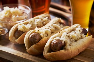 Classic German sausages topped with sauerkraut and paired with beer